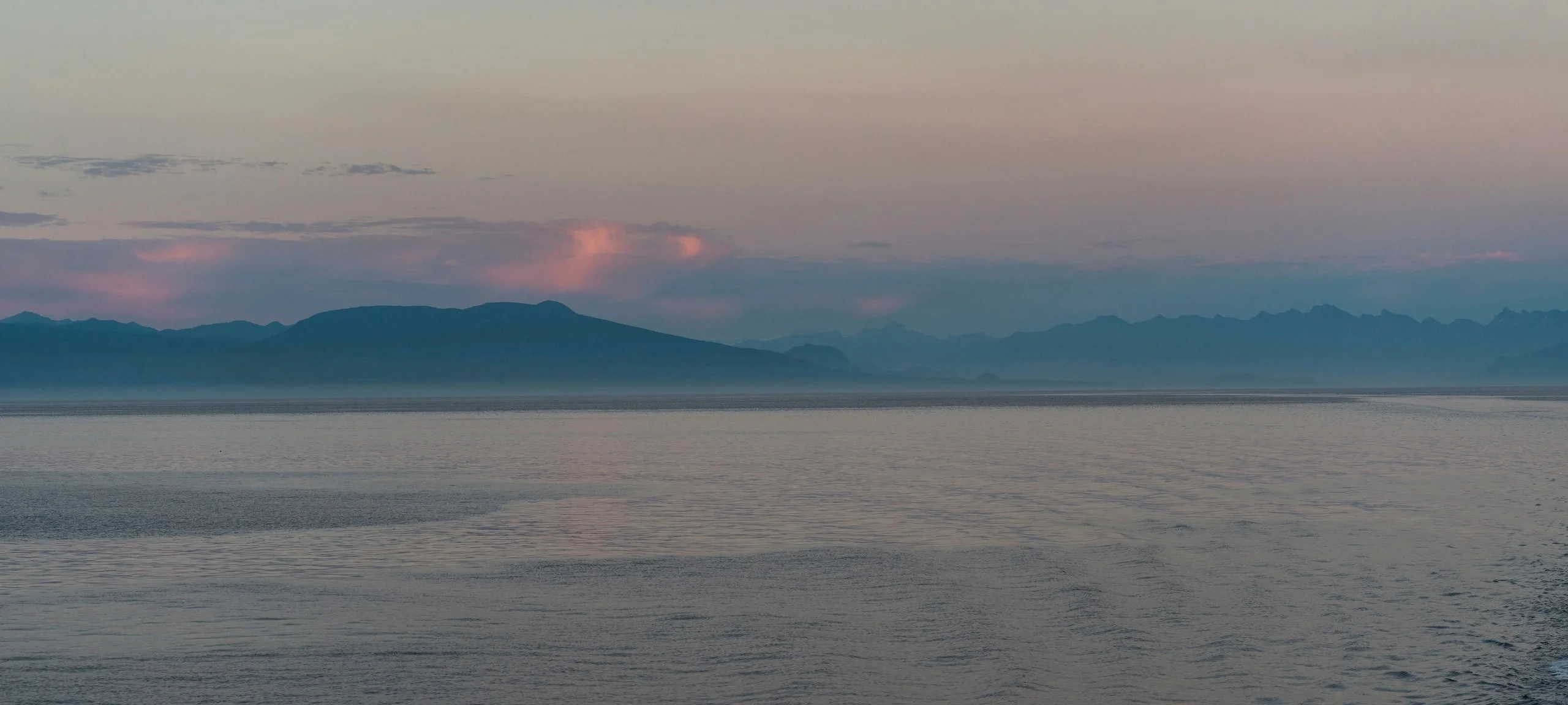Sun over mountains and ocean between Departure Bay and Horseshoe Bay