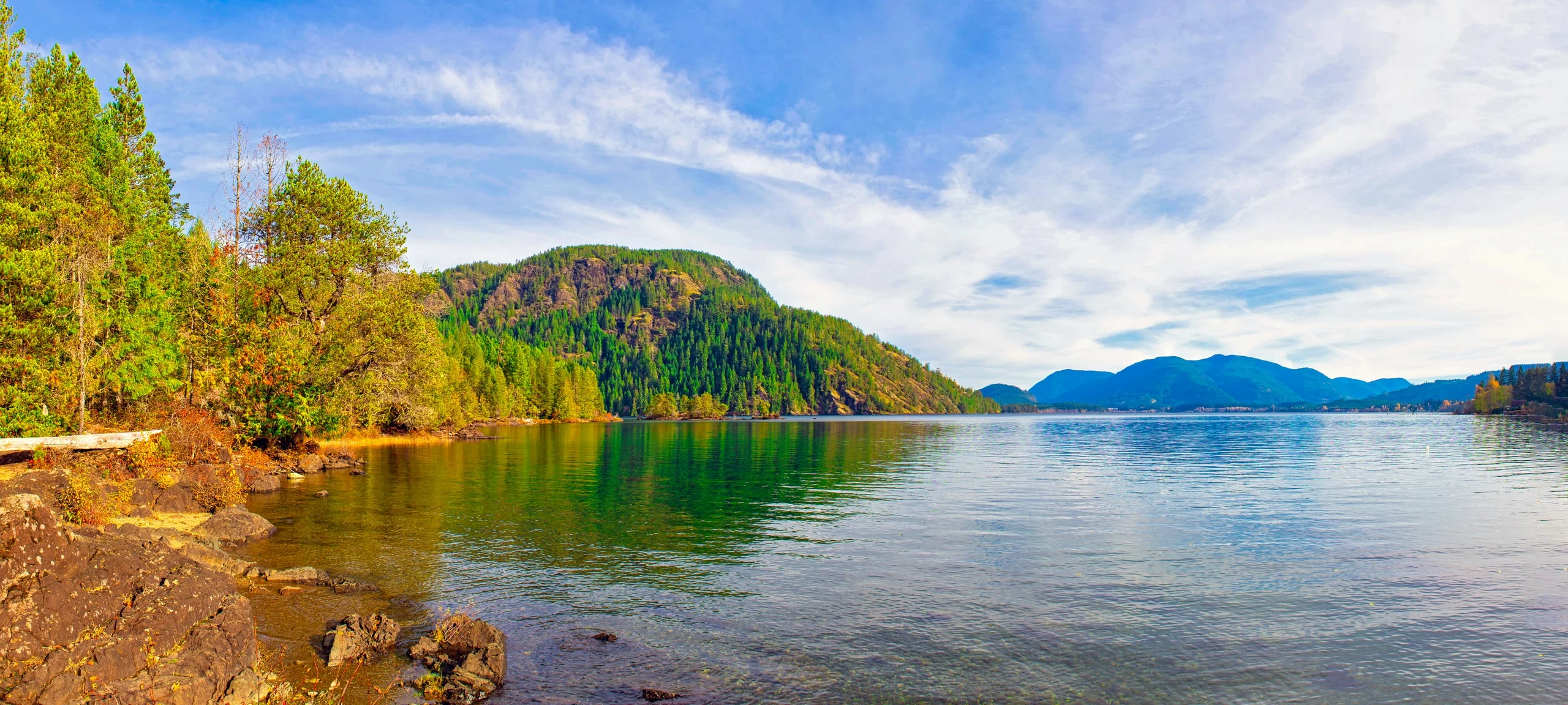Mountains on the shoreline of Gordon Bay Park at Cowichan Lake in Vancouver Island 
