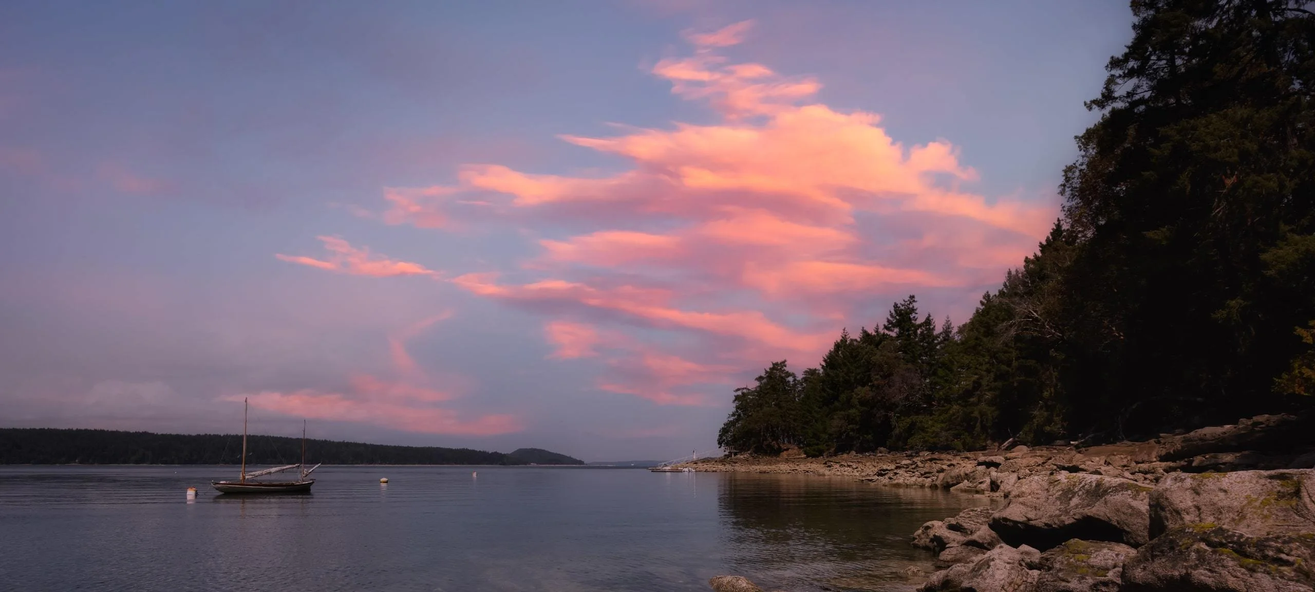 Pink sunset over water on Salt Spring Island, BC