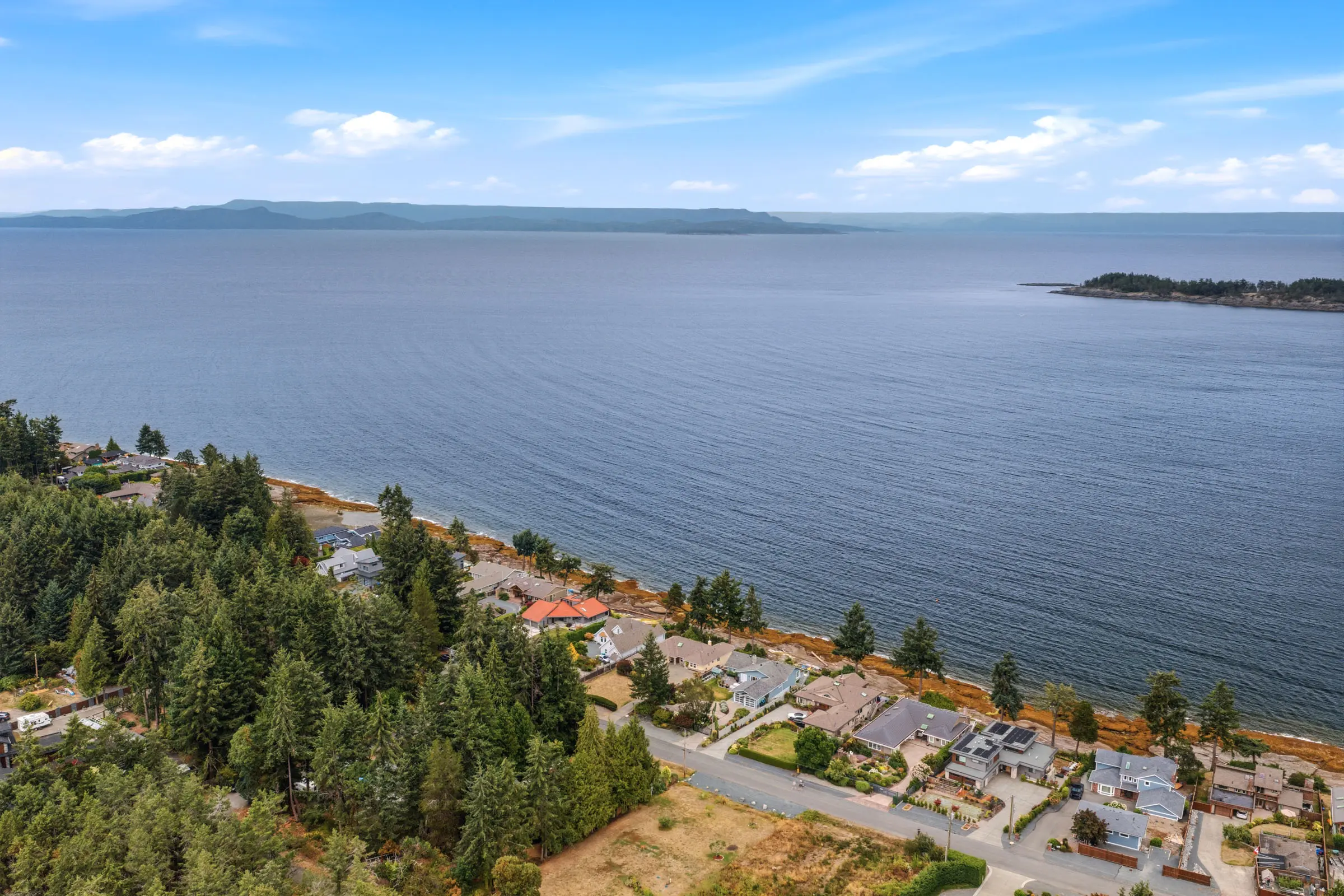 Ocean-view homes among the trees along Madrona Drive in Nanoose Bay, BC