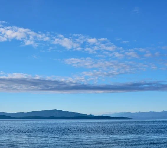Sunny day looking over mountains and Strait of Georgia