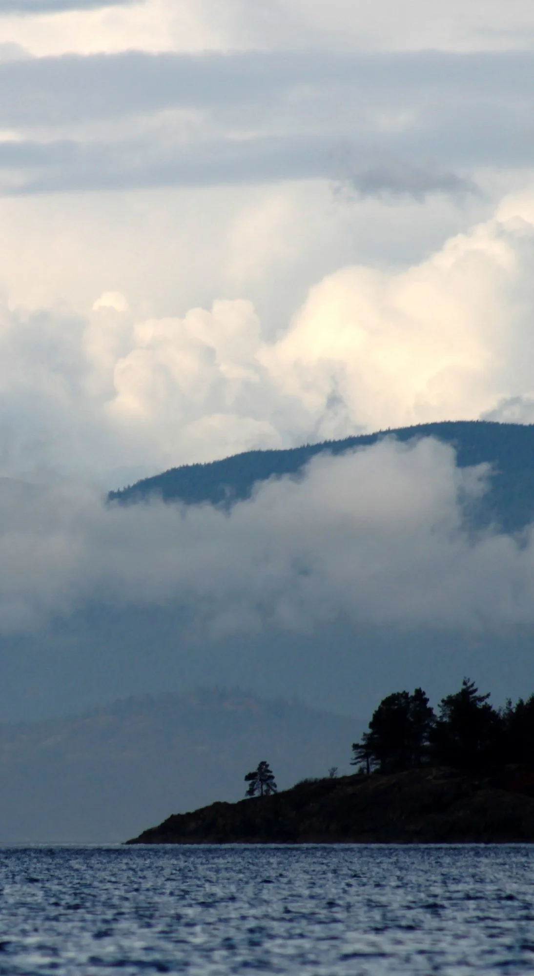 Foggy morning over Nanoose Bay shore with mountains