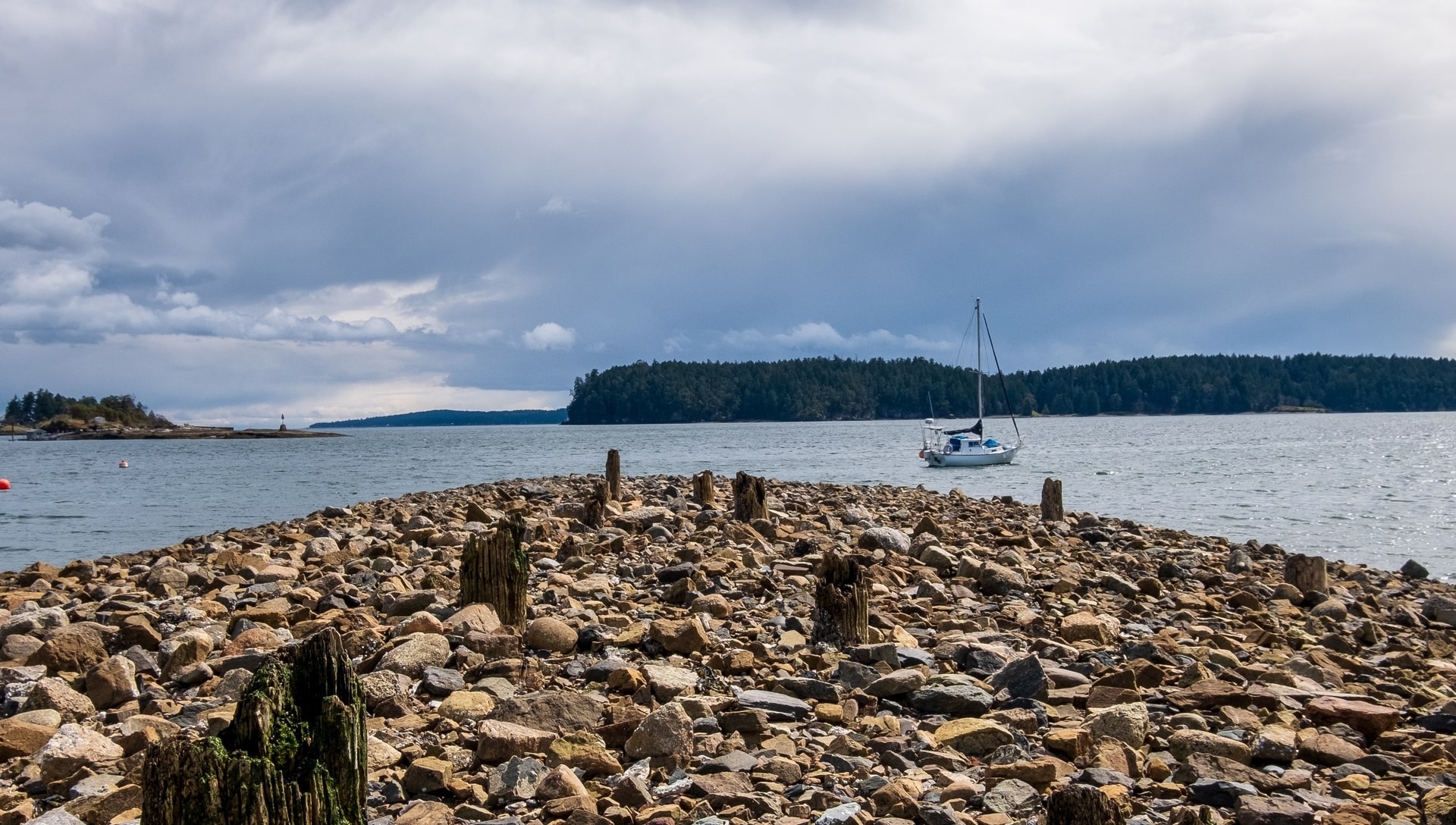 Broken wharf and boat at Depature Bay waterfront