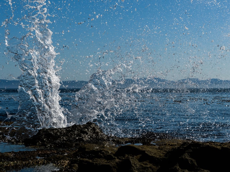 Water from waves crashing upwards on Ladysmith beach