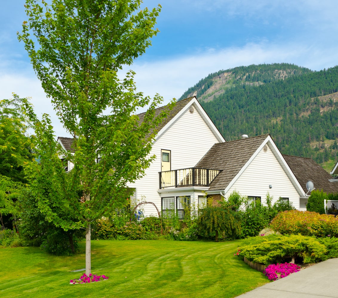 Traditional style house nestled between trees, typical of Lake Cowichan area