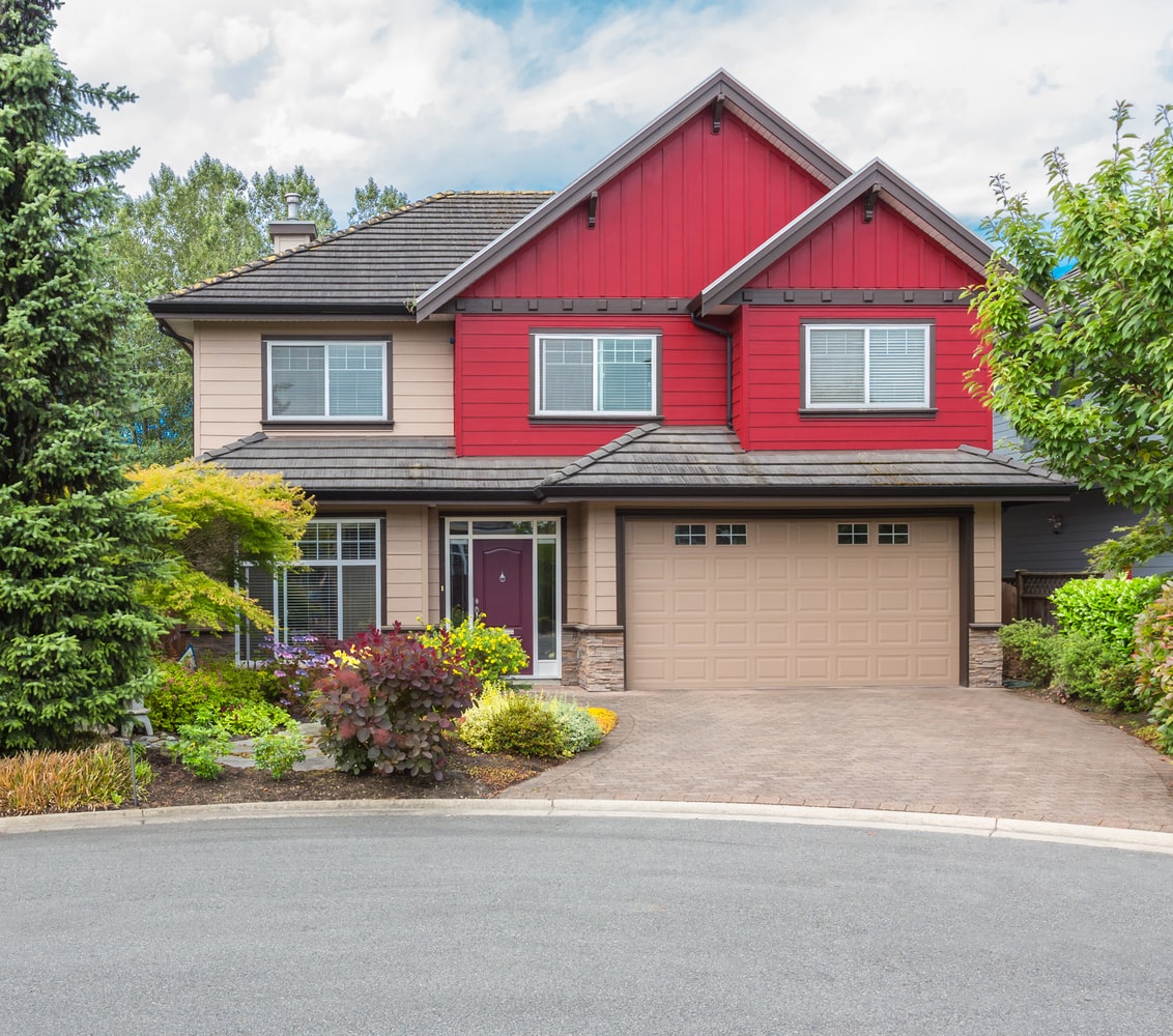 Red house in residential area, typical of Nanoose Bay