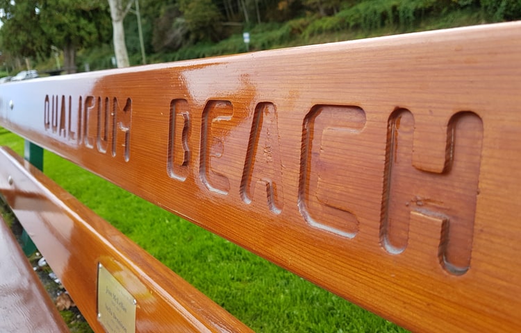 Bench with Qualicum Beach engraved into it