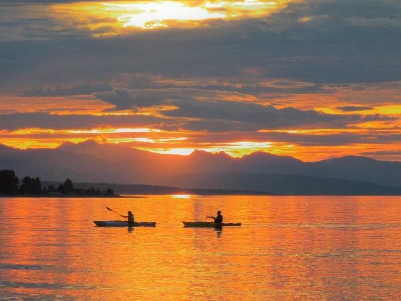 Two kayakers off the Qualicum coast during sunset