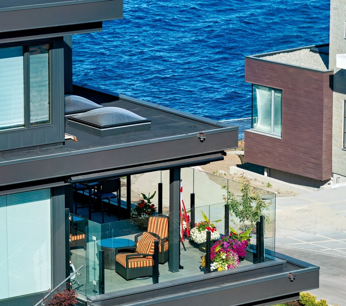 New construction modern home balcony, with view of waterfront